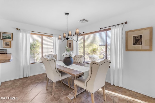 dining space featuring a chandelier