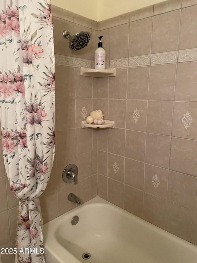 bathroom with shower / bath combination with curtain