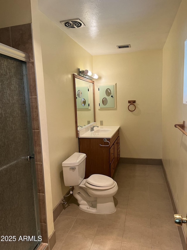 bathroom with toilet, a stall shower, visible vents, and tile patterned floors