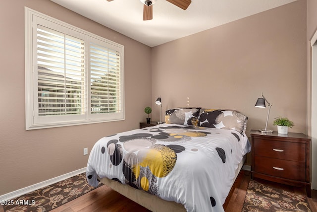 bedroom featuring hardwood / wood-style flooring and ceiling fan