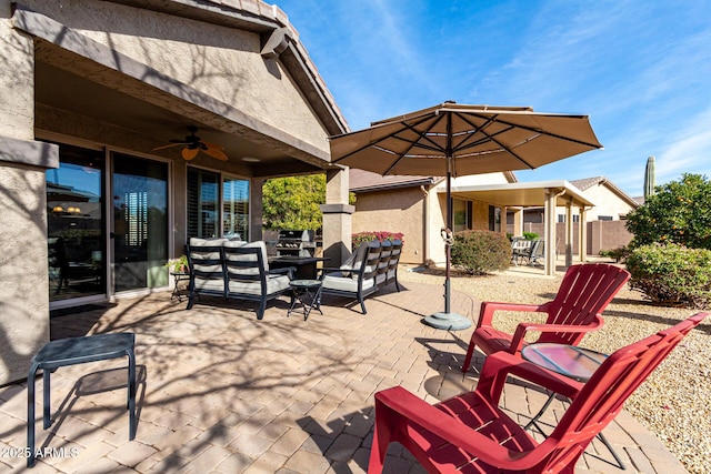 view of patio featuring an outdoor living space and ceiling fan