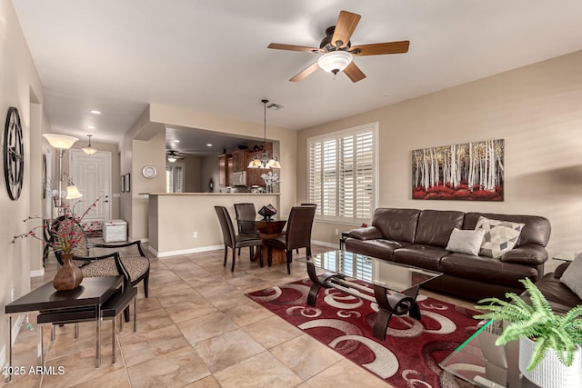 living room featuring ceiling fan and light tile patterned floors