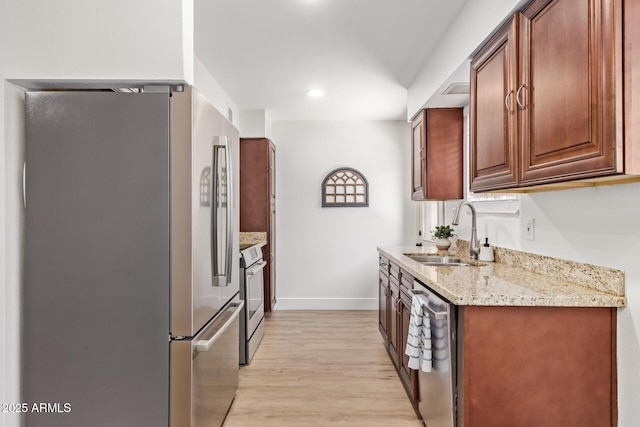 2015 E Southern Ave Unit 16, Tempe, AZ 85282 - kitchen with appliances with stainless steel finishes, light wood-style flooring, light stone counters, and recessed lighting