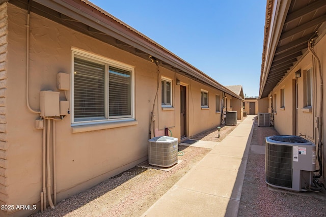 2015 E Southern Ave Unit 16, Tempe, AZ 85282 - view of side of home featuring a central AC unit and stucco siding