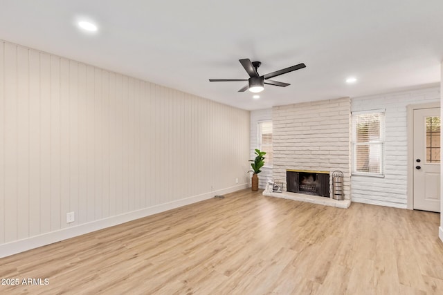 2015 E Southern Ave Unit 16, Tempe, AZ 85282 - unfurnished living room featuring wood finished floors, a ceiling fan, a brick fireplace, and recessed lighting