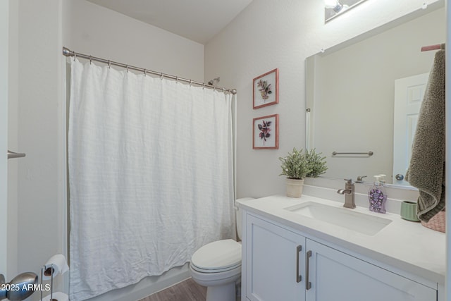 bathroom with shower / bathtub combination with curtain, toilet, vanity, and wood finished floors