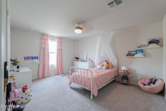 bedroom with baseboards, carpet flooring, ceiling fan, and visible vents