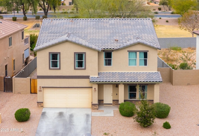 view of front facade with driveway, a garage, fence, and stucco siding