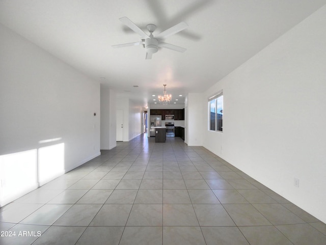 unfurnished living room with light tile patterned flooring and ceiling fan with notable chandelier