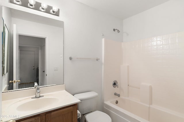 bathroom with toilet, shower / washtub combination, and vanity