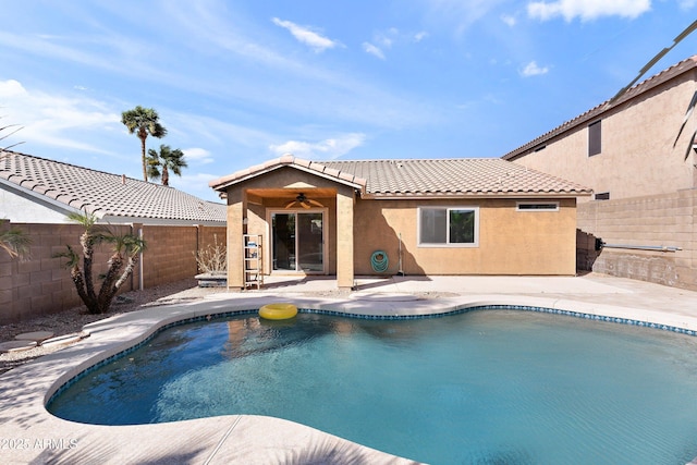 view of swimming pool featuring a fenced backyard, a fenced in pool, and a patio