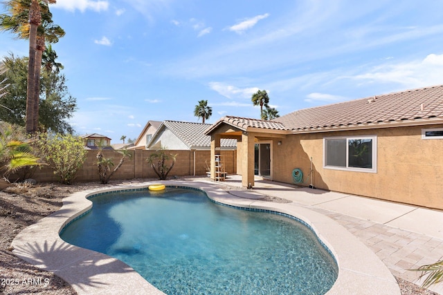 view of pool featuring a patio, a fenced backyard, and a fenced in pool