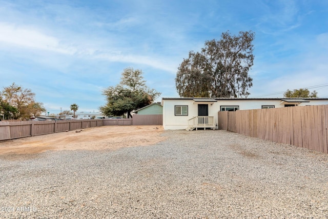 view of front of house with a fenced backyard