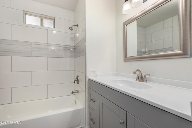 full bathroom featuring vanity and  shower combination