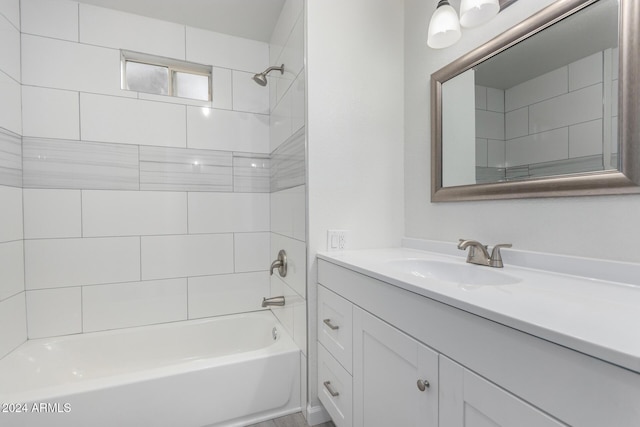 full bathroom featuring vanity and washtub / shower combination