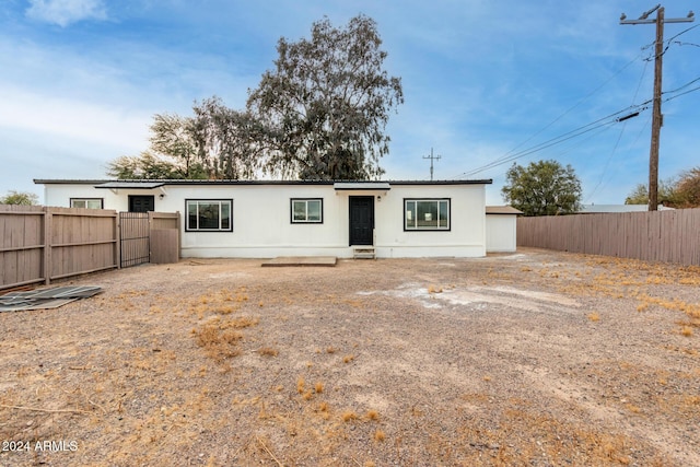 back of house featuring a fenced backyard