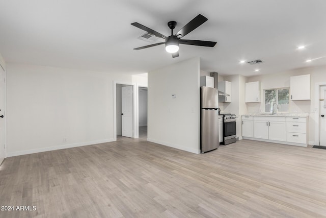 unfurnished living room featuring light wood-style flooring, baseboards, visible vents, and ceiling fan