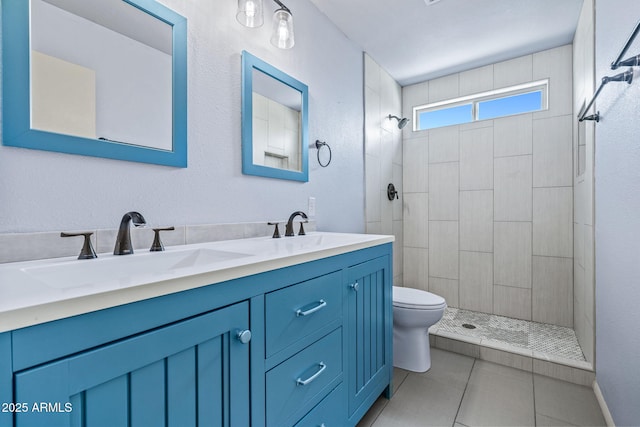 3747 W Aire Libre Ave, Phoenix, AZ 85053 - bathroom with toilet, double vanity, tiled shower, and tile patterned floors