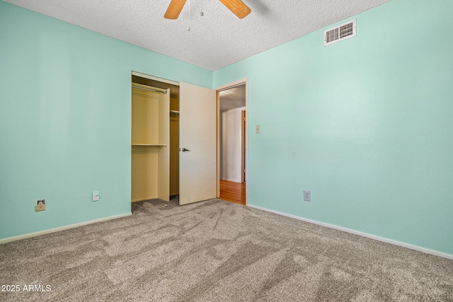 3747 W Aire Libre Ave, Phoenix, AZ 85053 - unfurnished bedroom featuring carpet flooring, a textured ceiling, a closet, ceiling fan, and baseboards