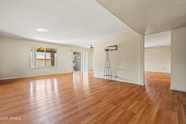 3747 W Aire Libre Ave, Phoenix, AZ 85053 - unfurnished room with light wood-type flooring, a ceiling fan, and baseboards
