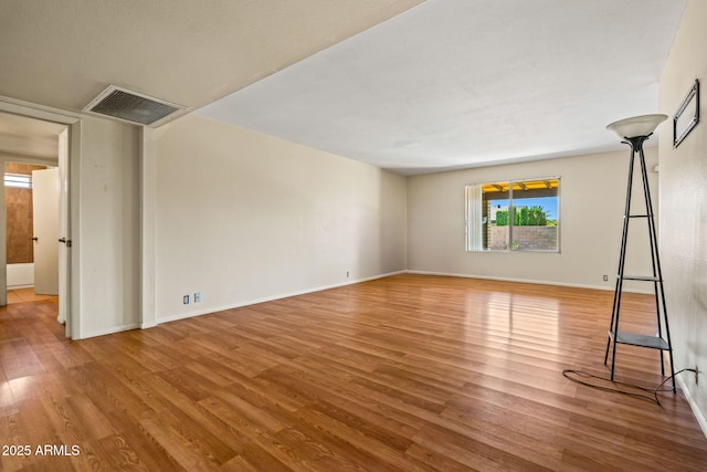 3747 W Aire Libre Ave, Phoenix, AZ 85053 - empty room with wood finished floors and baseboards
