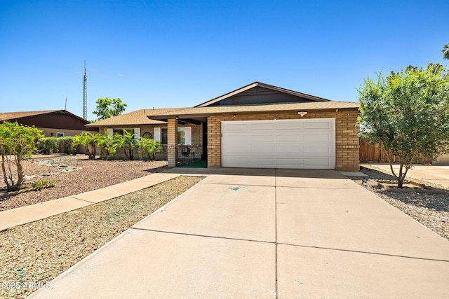 3747 W Aire Libre Ave, Phoenix, AZ 85053 - single story home with a garage, concrete driveway, and brick siding
