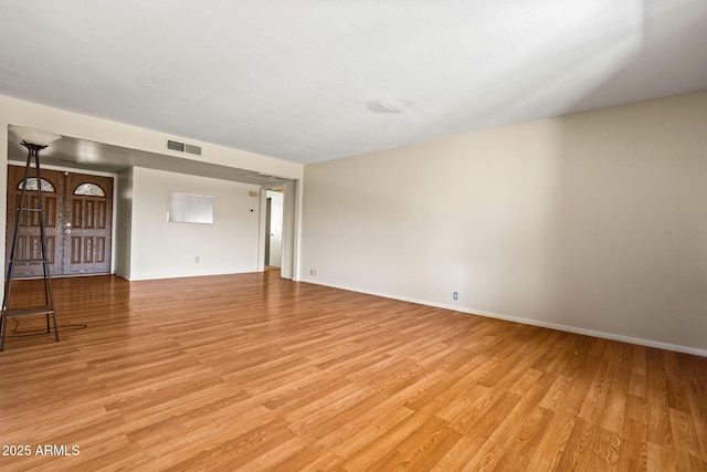 3747 W Aire Libre Ave, Phoenix, AZ 85053 - spare room with light wood-style floors and baseboards