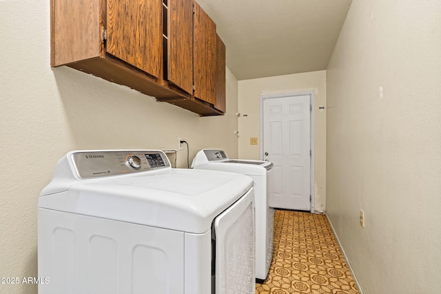 3747 W Aire Libre Ave, Phoenix, AZ 85053 - washroom featuring washer and clothes dryer, cabinet space, and light floors