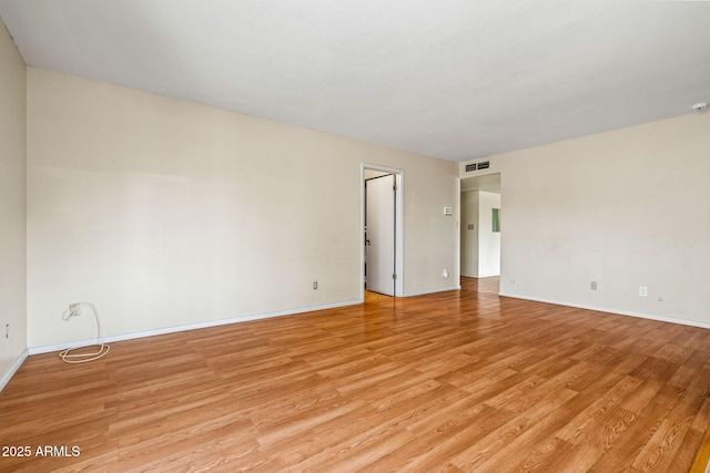 3747 W Aire Libre Ave, Phoenix, AZ 85053 - unfurnished room with light wood-style floors and baseboards