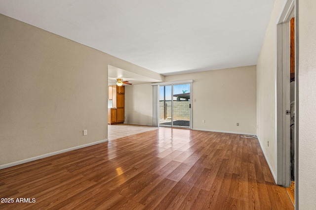 3747 W Aire Libre Ave, Phoenix, AZ 85053 - unfurnished room with wood finished floors, baseboards, and ceiling fan