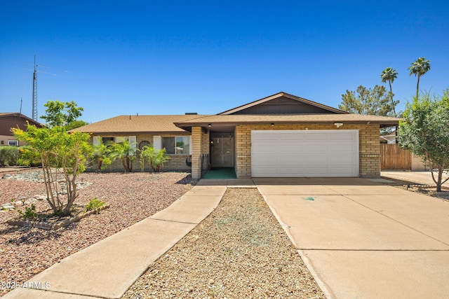 3747 W Aire Libre Ave, Phoenix, AZ 85053 - ranch-style house featuring an attached garage, brick siding, and driveway