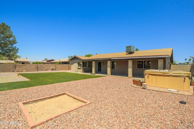 3747 W Aire Libre Ave, Phoenix, AZ 85053 - rear view of property with a hot tub, central AC, a patio area, and brick siding