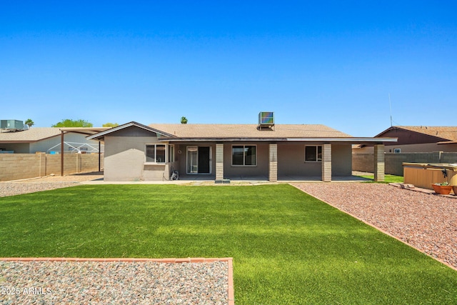 3747 W Aire Libre Ave, Phoenix, AZ 85053 - rear view of house featuring a patio area, a hot tub, and central AC unit