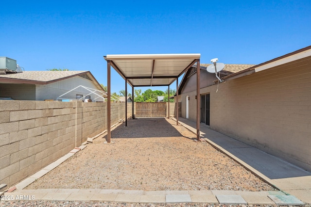 3747 W Aire Libre Ave, Phoenix, AZ 85053 - fenced backyard with central AC, a patio, and a detached carport
