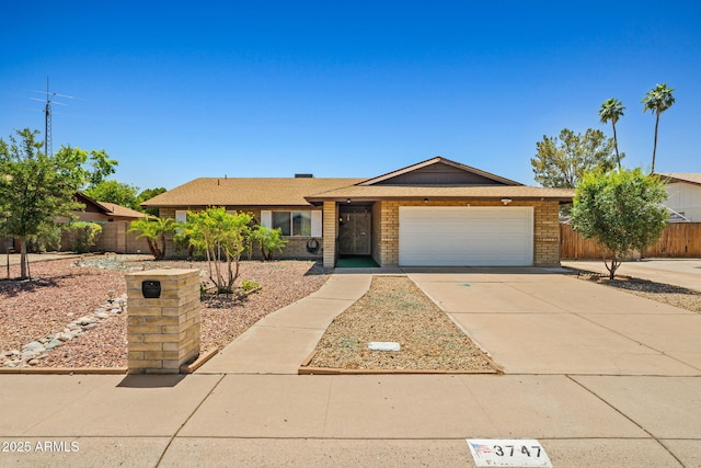3747 W Aire Libre Ave, Phoenix, AZ 85053 - single story home featuring a garage, driveway, and brick siding