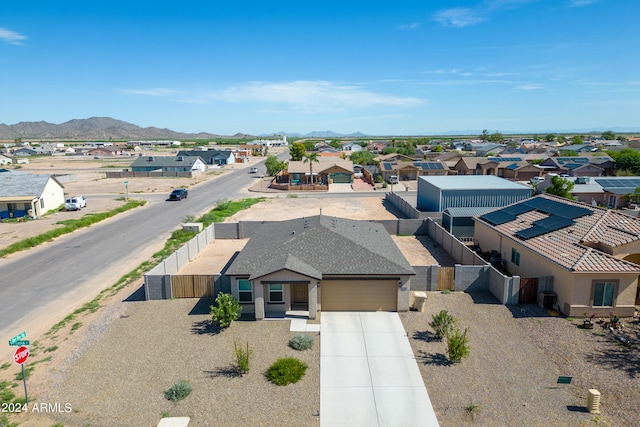 birds eye view of property with a mountain view