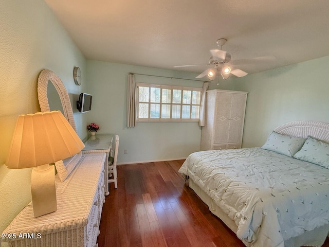 bedroom featuring ceiling fan and dark hardwood / wood-style flooring