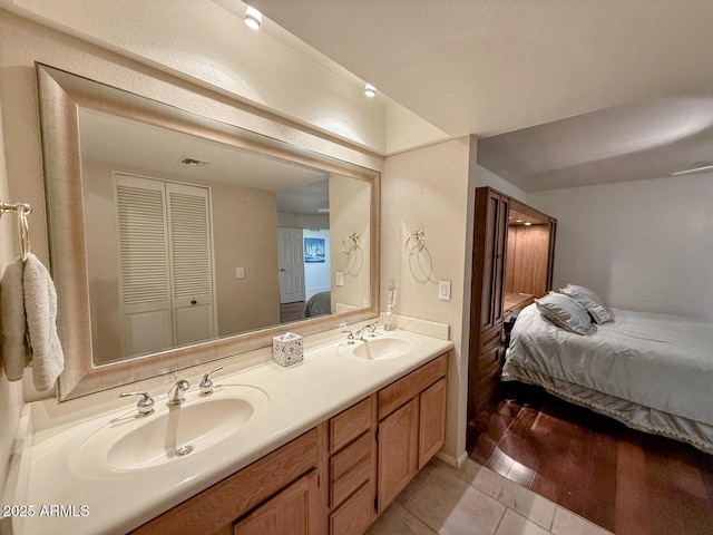 bathroom featuring tile patterned floors and vanity