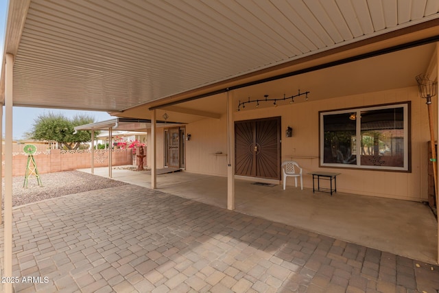 view of patio / terrace featuring fence