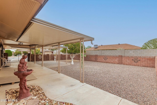 view of patio / terrace with fence and a gate