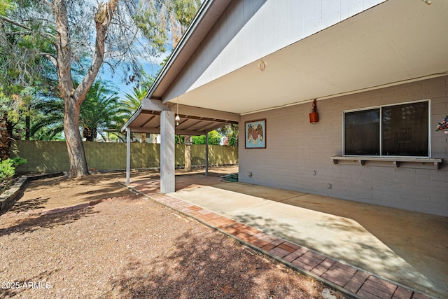 view of patio / terrace featuring fence