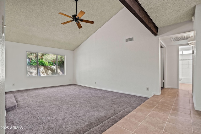 spare room with ceiling fan, a textured ceiling, and visible vents