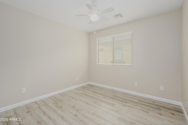 41715 N Raleigh Ct, Anthem, AZ 85086 - empty room with wood finished floors, ceiling fan, and baseboards