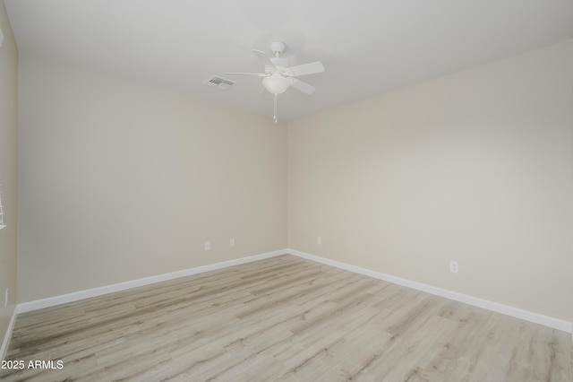 41715 N Raleigh Ct, Anthem, AZ 85086 - empty room featuring wood finished floors, ceiling fan, and baseboards