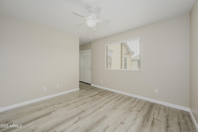 41715 N Raleigh Ct, Anthem, AZ 85086 - empty room featuring wood finished floors, baseboards, and ceiling fan