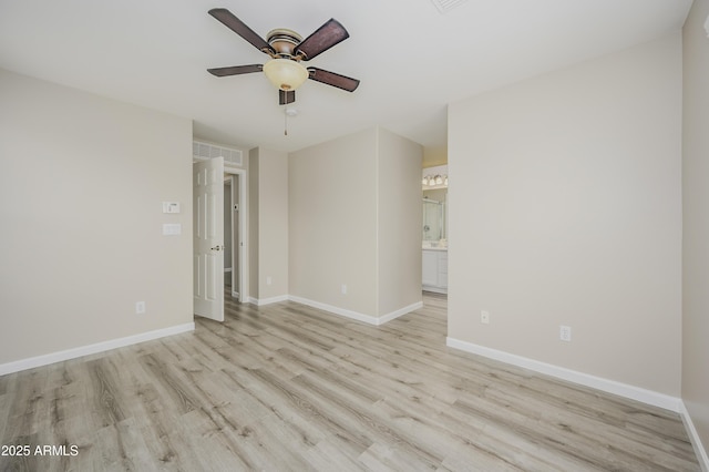41715 N Raleigh Ct, Anthem, AZ 85086 - empty room with a ceiling fan, light wood-type flooring, and baseboards