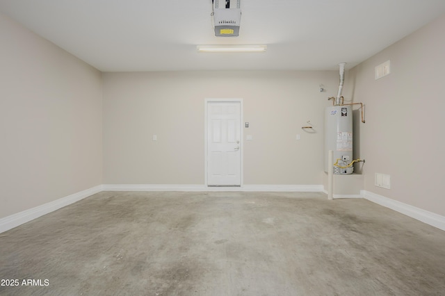 41715 N Raleigh Ct, Anthem, AZ 85086 - garage with gas water heater, a garage door opener, and baseboards