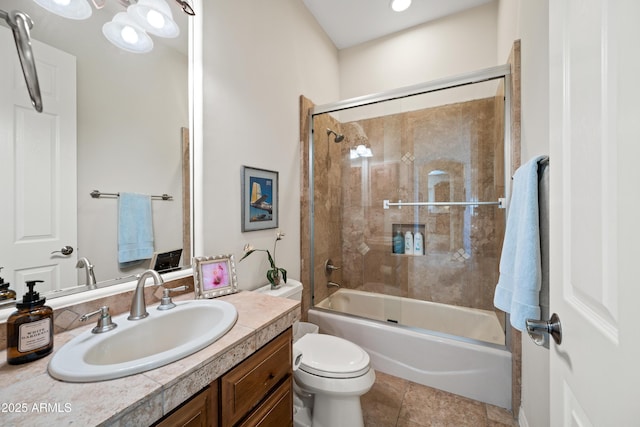 full bathroom featuring vanity, combined bath / shower with glass door, and toilet