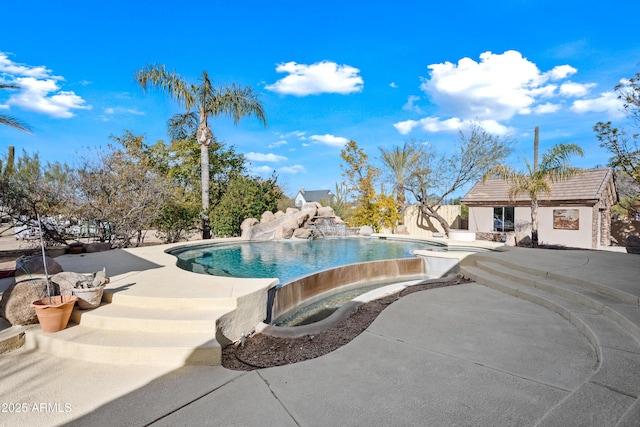 view of pool featuring an outdoor structure and a patio