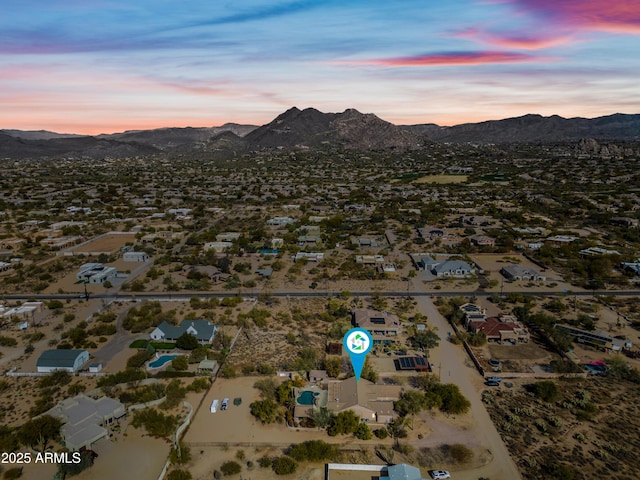 aerial view at dusk with a mountain view